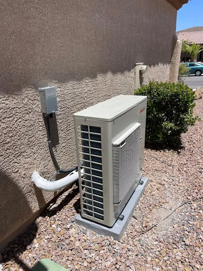 Residential air conditioning condenser unit in Melrose